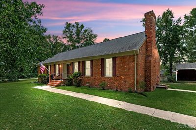 View of front of property featuring a yard | Image 1