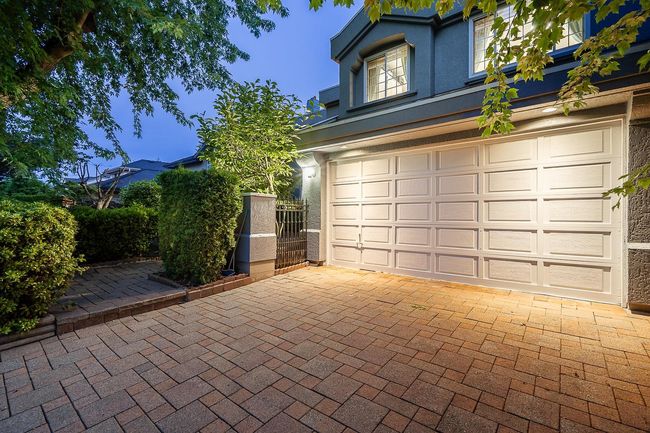 Garage featuring decorative driveway | Image 4
