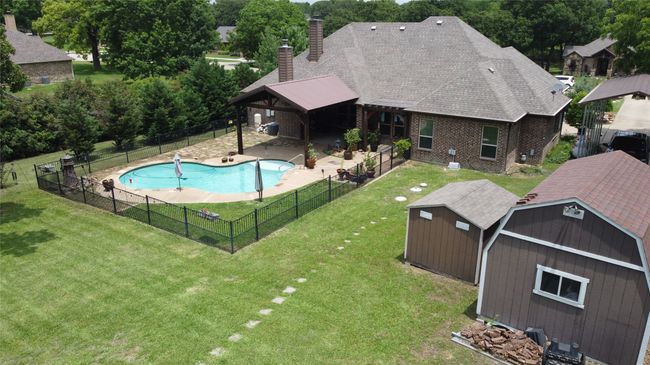 View of swimming pool featuring a patio area | Image 38