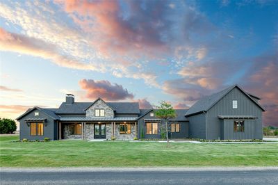 Modern farmhouse style home with a yard | Image 1