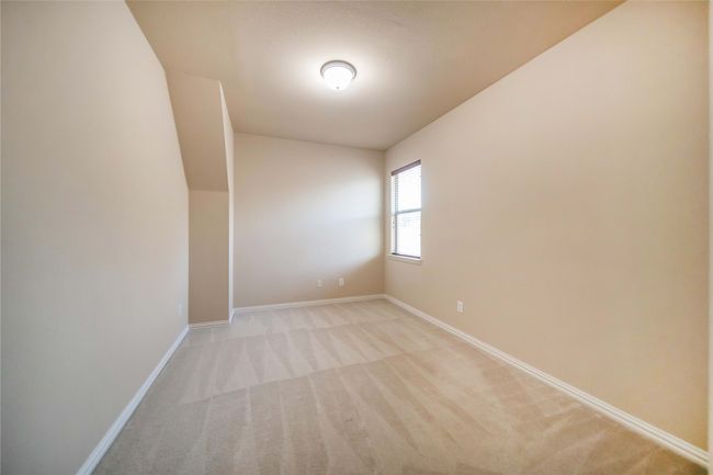 Unfurnished room with light colored carpet and baseboards | Image 25
