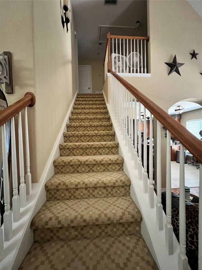 Staircase featuring arched walkways and carpet floors | Image 14