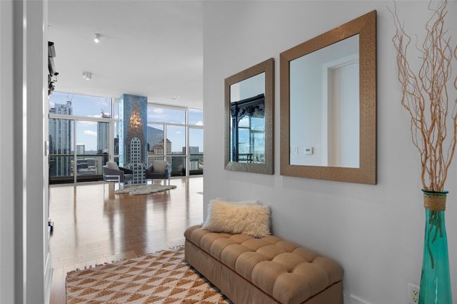 As you step into the condo, a cozy corner invites you in and reveals views from various parts of the living and dining areas | Image 21