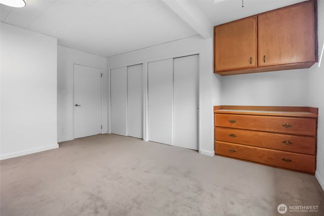 Dual closets plus a built-in dresser provide ample storage space. | Image 18