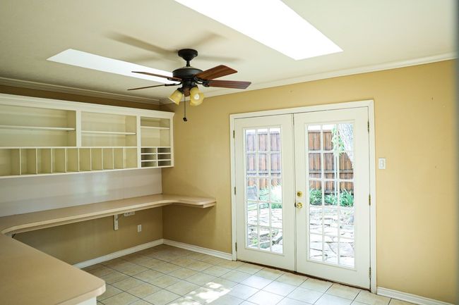 Entryway with a skylight, healthy amount of natural light, french doors, and ornamental molding | Image 16