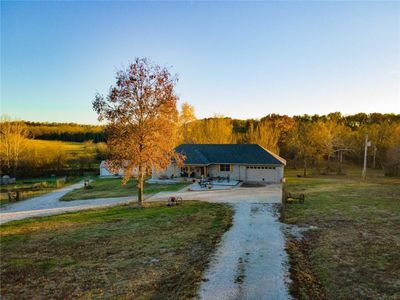 View of front of home with a front lawn and a garage | Image 2