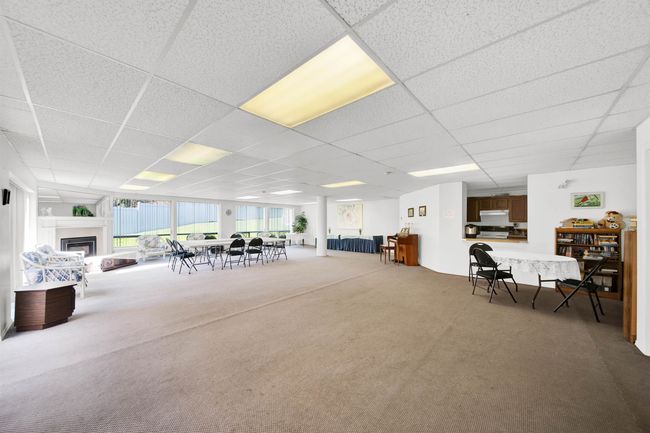 Washroom with light carpet, laundry area, separate washer and dryer, and baseboards | Image 19