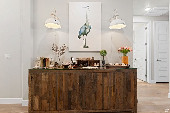 Bar with light wood-type flooring and baseboards | Image 55