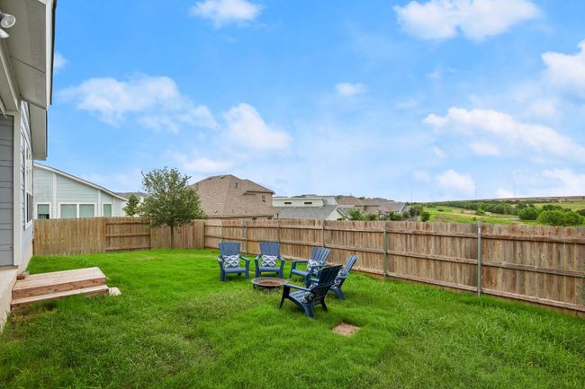 View of fenced backyard | Image 25