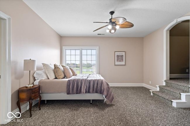 Bedroom #3 upstairs features its own walk-in closet, bathroom and a separate seating area. | Image 37