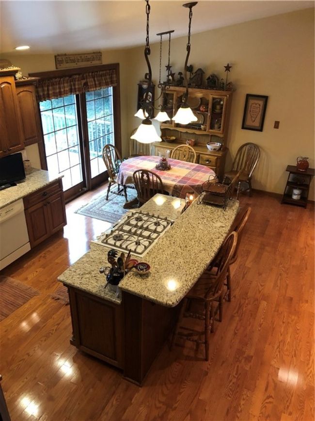 the patio doors open to the two tiered deck | Image 5