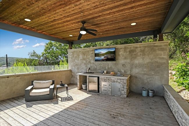 Deck featuring area for grilling and ceiling fan | Image 37