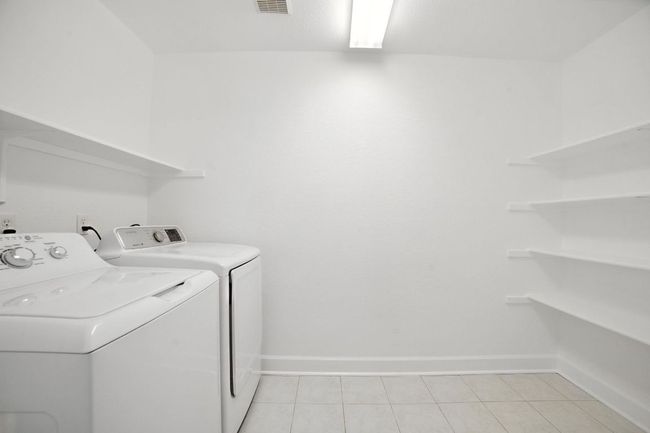 The home also features a smart thermostat, water softener, and a 2-car garage. | Image 24
