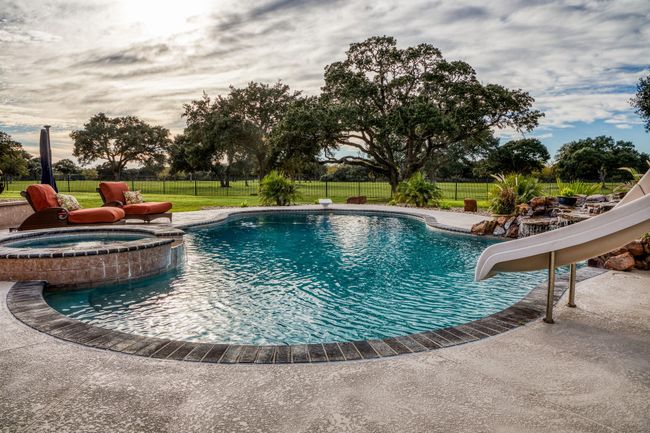 Sparking pool, hot tub and slide. | Image 9
