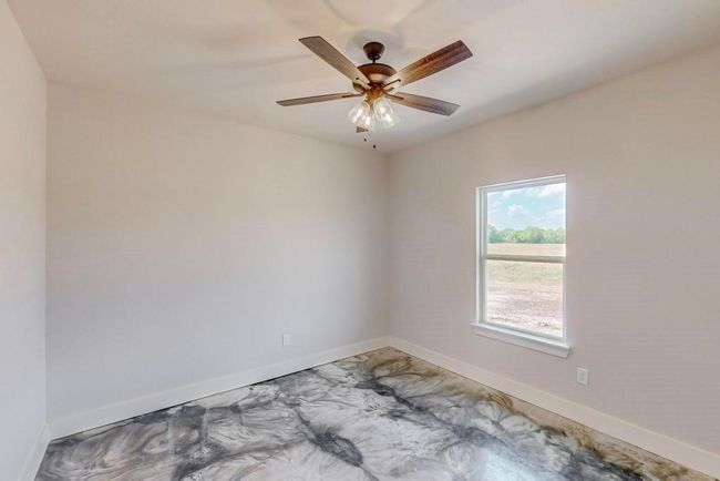 Spare room with baseboards and a ceiling fan | Image 24