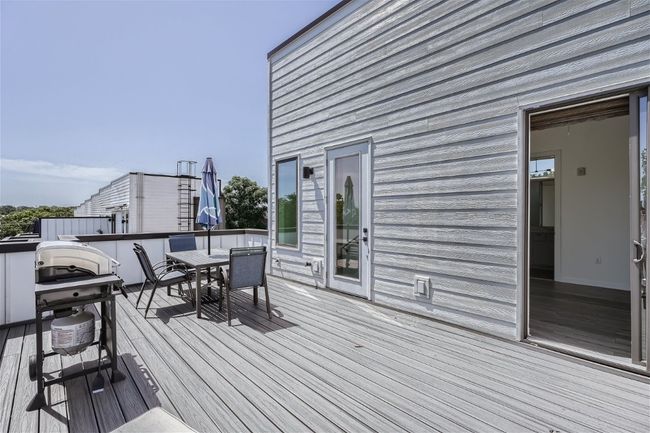 Enjoy the upstairs expansive private deck, ideal for outdoor entertaining. | Image 18