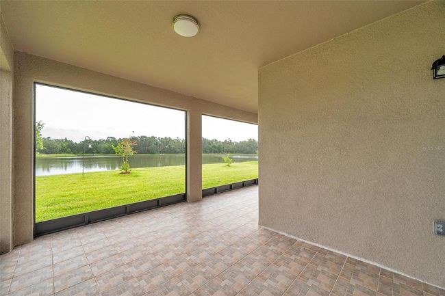 large, screened patio with water view | Image 53
