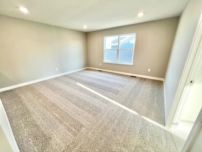 Actual home: Large loft area on the upper level, perfect for additional living space, play area, etc! | Image 22