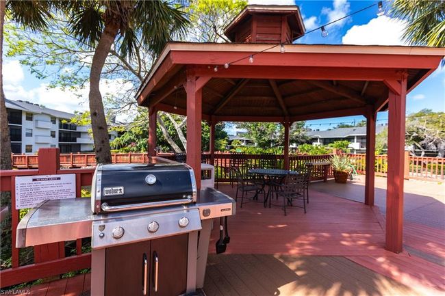 Wooden deck featuring a gazebo | Image 44
