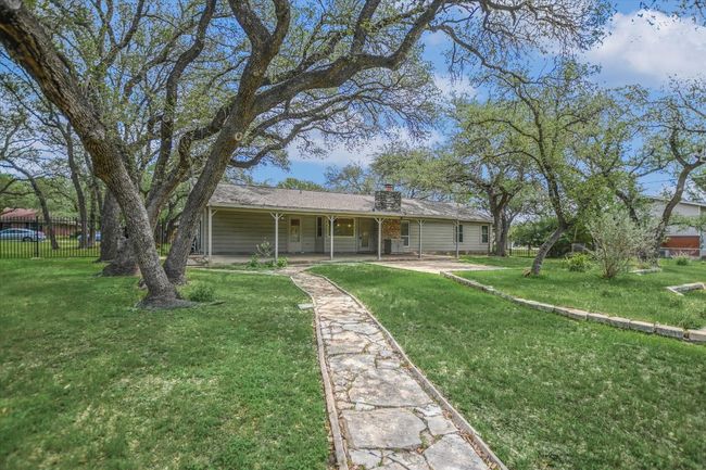 Single story home with a chimney and a patio | Image 20