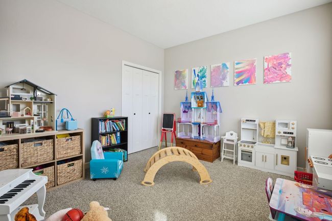 Main floor bedroom currently used as playroom | Image 23