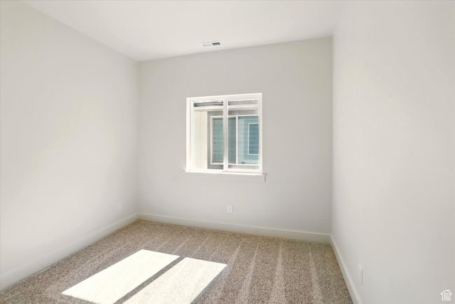 Empty room featuring carpet and baseboards | Image 25