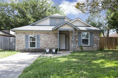 View of front facade with a front lawn | Image 2