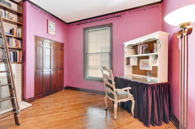 Bedroom 2 is currently used as an office, also with double closet and newer hardwood floors. | Image 18