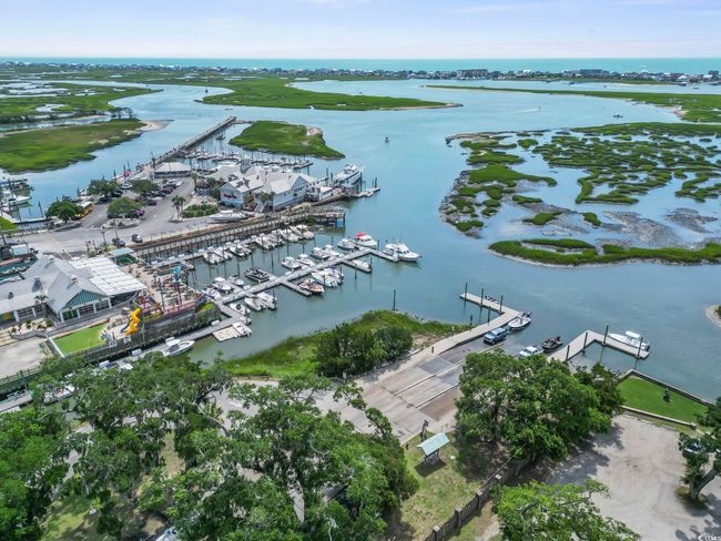 Drone / aerial view of a nearby body of water and numerous boat docks | Image 31