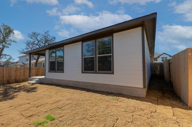 View of side of home featuring a fenced backyard | Image 36