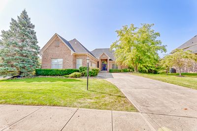 OUTDOOR LIVING: View of the Main Level Deck accessed just off of the Kitchen and Screened In Porch. Lush warm weather foiilage offers a mature and private canvas for a private setting during during the Outdoor Living season. | Image 2