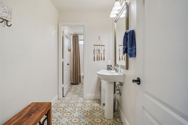 View of full bathroom with separate toilet, tub/shower area. | Image 18