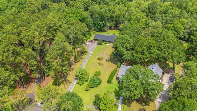 Bird's eye view of a heavily wooded area | Image 35