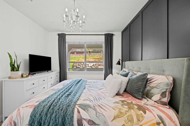 Bedroom featuring a notable chandelier | Image 15