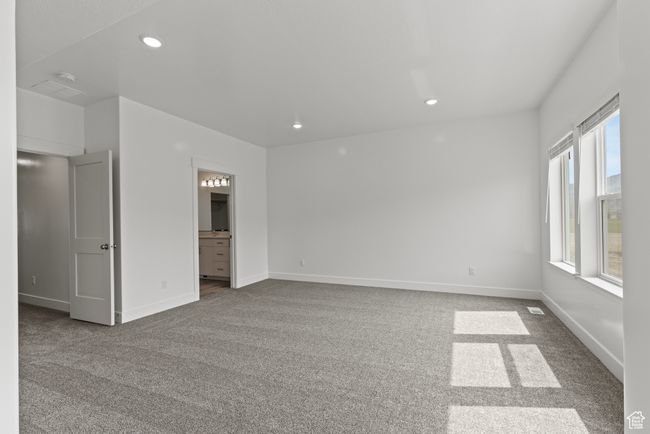 Unfurnished room with recessed lighting, dark colored carpet, and baseboards | Image 8