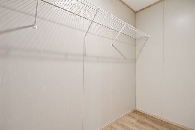 Walk in closet with wood finished floors | Image 22