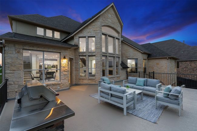 Patio terrace at dusk featuring an outdoor hangout area | Image 33