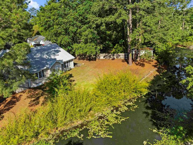 Aerial view featuring a view of trees and a water view | Image 35