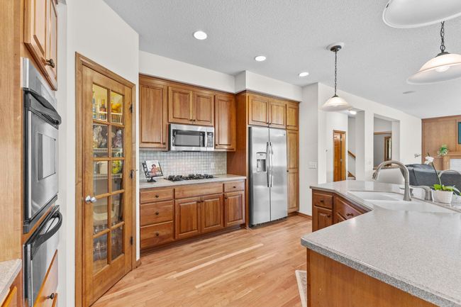 Large pantry in corner of kitchen | Image 19