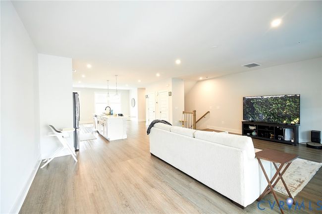 Living area featuring light wood-style flooring and recessed lighting | Image 43