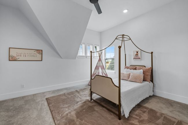 Bedroom featuring carpet and ceiling fan | Image 30
