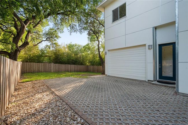 View of patio featuring an attached garage and driveway | Image 30