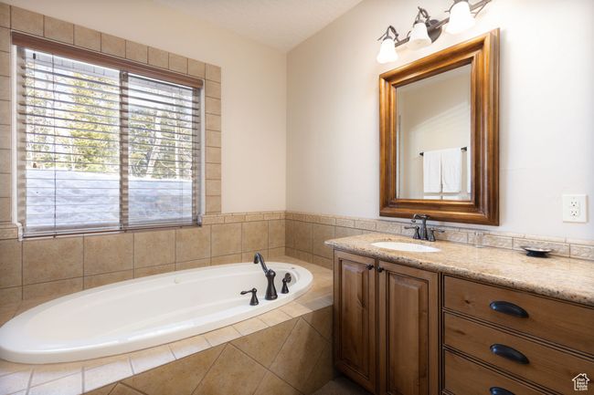Bathroom featuring vanity and a garden tub | Image 30