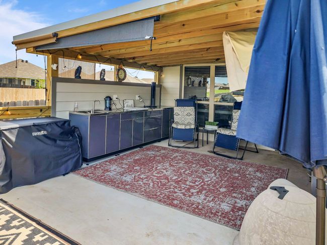 View of patio with exterior bar | Image 31