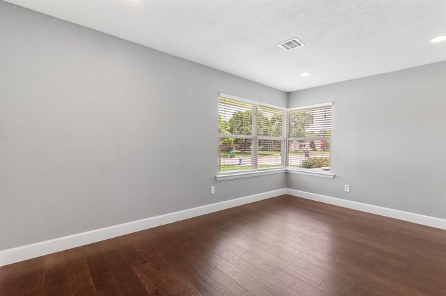 Another view of the flex room with corner picture windows for plenty of natural light and views of the front yard. | Image 8