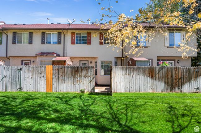 Rear view of property featuring stucco siding | Image 24
