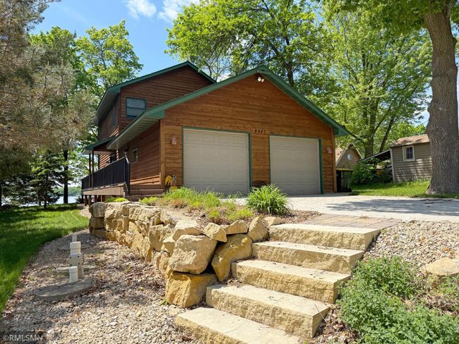 A double attached garage and covered side deck welcomes you home, you'll love adding your own personal touch! | Image 5