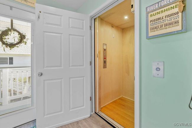 Property entrance featuring elevator that is so, so handy and great from bringing groceries and packages up from that awesome two car, direct entry garage. | Image 11