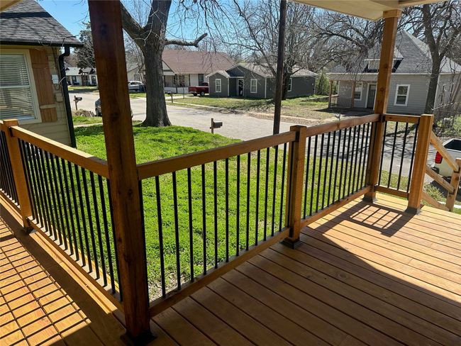 Wooden deck featuring a residential view and a lawn | Image 28