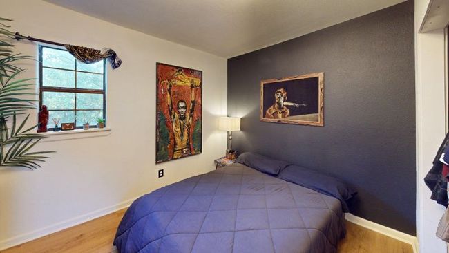 One of two casita bedrooms with wood finished floors and central heat & A/C | Image 32